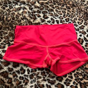 Teeki red booty workout shorts.